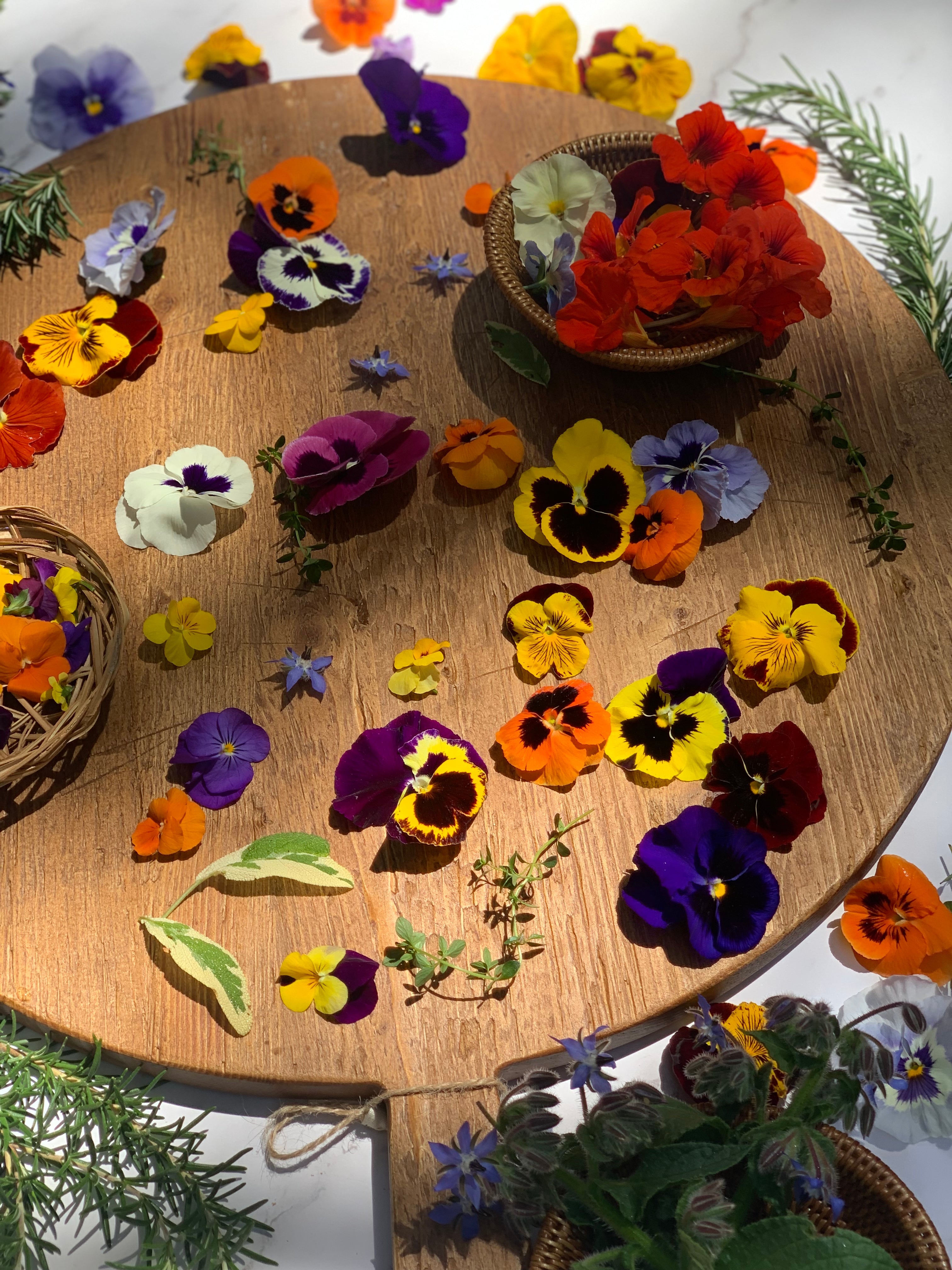 edible flowers on a wooden table