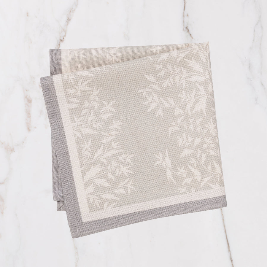 grey napkin with cream floral details
