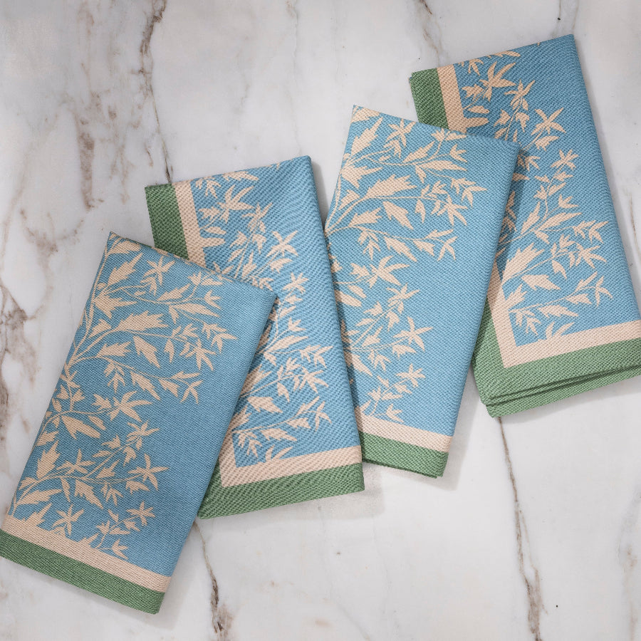 blue and green napkin with cream floral details
