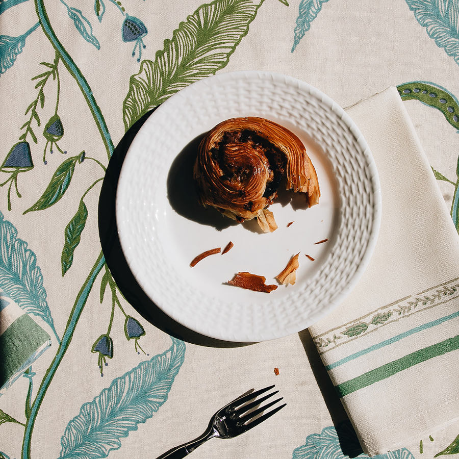 baked good on cream, blue, and green tablecloth