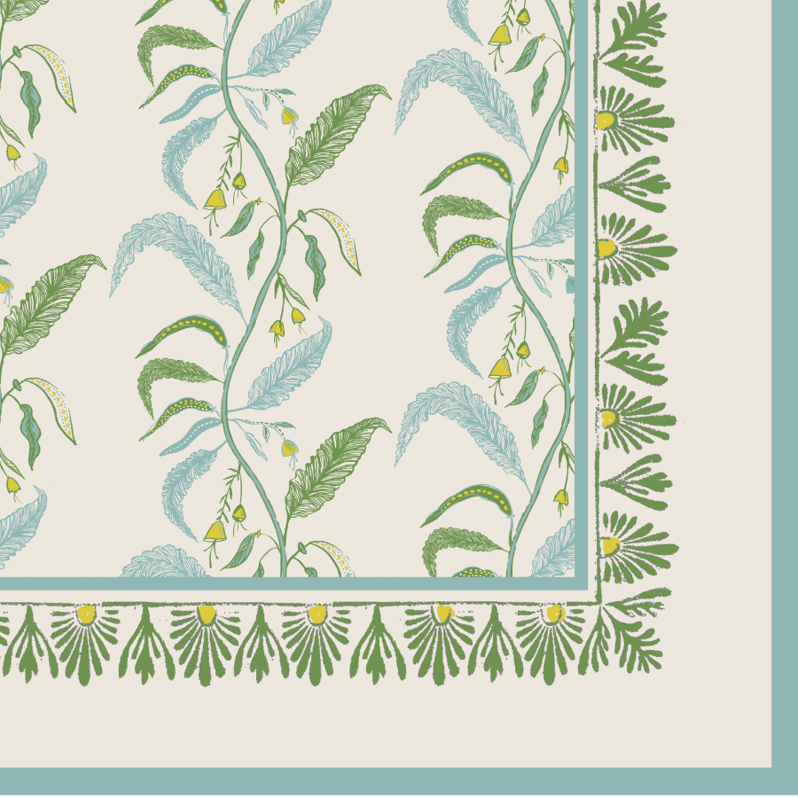 cream, green, and blue tablecloth with floral design