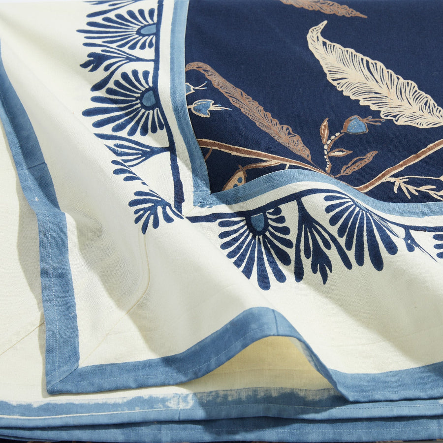 cream and blue tablecloth with floral design