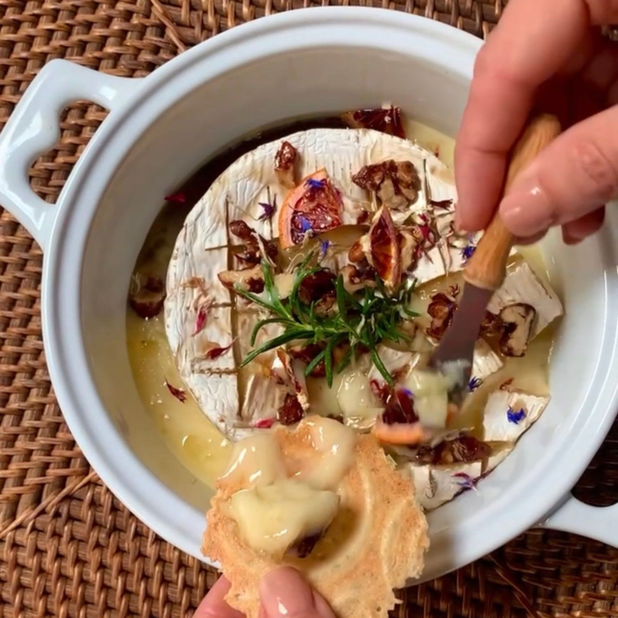 hands holding a cheese knife for brie baker giffting